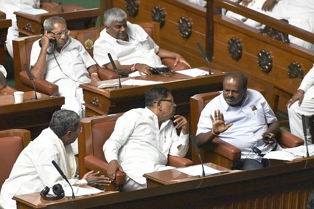 Dy CM Dr G Parameshwara in conversation with CM Kumaraswamy in the Karnataka Vidhana Sabha. (Photo by Arijit Sen/Hindustan Times via Getty Images)