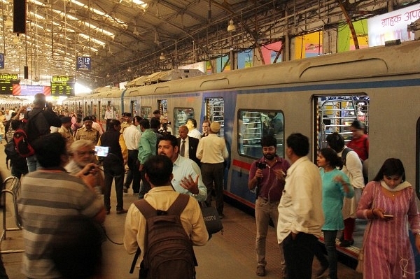 Passengers ready to board the air-conditioned suburban train at Churchgate station in Mumbai (Pramod Thakur/Hindustan Times via Getty Images)