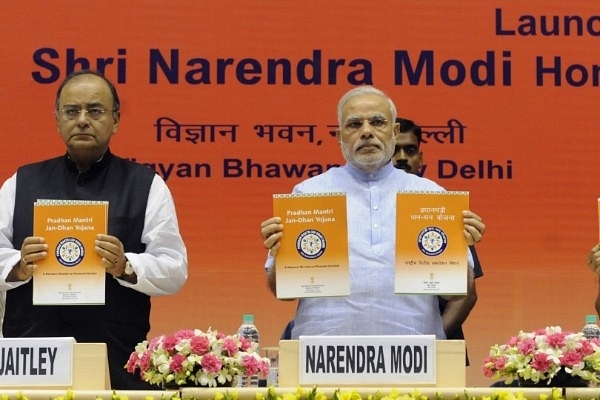 PM Modi  with Finance Minister Arun Jaitley at the launch of Pradhan Mantri Jan Dhan Yojana in New Delhi. (Mohd Zakir/Hindustan Times via Getty Images)