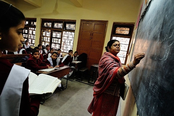 A teacher teaching in class at Sarvodaya Kanya Vidyalaya school at Lal Kuan, Chandni Chowk, in New Delhi, India. (Priyanka Parashar/Hindustan Times via Getty Images)