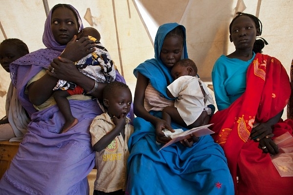 Refugees waiting in Africa for a malaria test (Paula Bronstein/Getty Images)