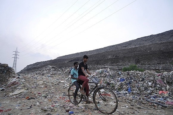 What Living Near A Trash Pile Almost As Tall As Qutub Minar Means For Health Of Residents