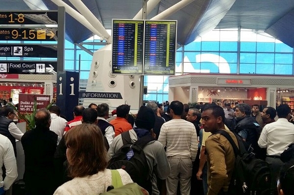 Passengers waiting inside the Delhi Airport (Burhaan Kinu/Hindustan Times)