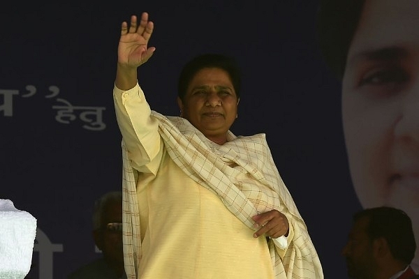 BSP leader Mayawati waves to the crowd upon her arrival at an election rally. (MONEY SHARMA/AFP/Getty Images)