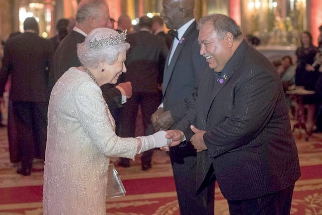 Queen Elizabeth II greets Baron Waqa, President of Nauru. (Victoria Jones - WPA Pool/Getty Images)