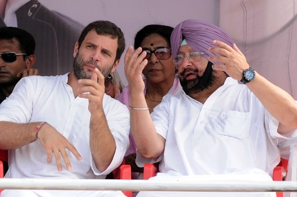 Congress President Rahul Gandhi with Chief Minister of Punjab Capt. Amarinder Singh during a rally. (Bharat Bhushan/Hindustan Times via Getty Images)