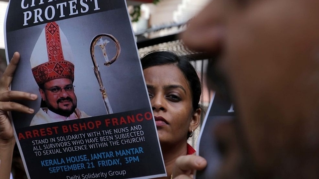  People hold a protest against Bishop Franco Mulakkal for his arrest outside the Kerala House. (Biplov Bhuyan/Hindustan Times via Getty Images)