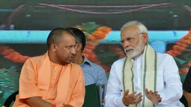 Prime Minister Narendra Modi  and Uttar Pradesh Chief Minister Yogi Adityanath. (Rajesh Kumar/Hindustan Times via GettyImages)&nbsp;