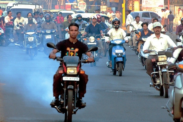 Scooters and bikes pollution on road in Pune, India. (Sandesh Bhandare/The India Today Group/Getty Images)