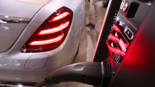 An electric car next to a charging station. (Sean Gallup/GettyImages)