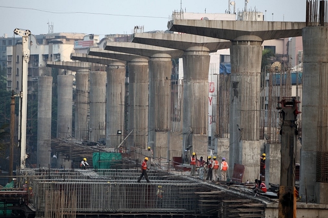 Workers wrapping up work at the Metro rail site in Andheri as the projects near completion in February, 2011 (Photo by Sattish Bate/Hindustan Times via Getty Images)