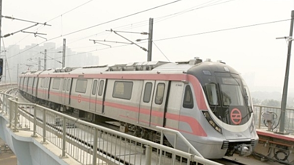 A metro plying on the Pink Line (Mohd Zakir/Hindustan Times via Getty Images)