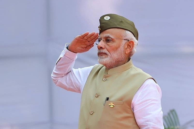 Donning the Azad Hind Fauj cap, the Prime Minister hoisted the national flag at Red Fort to mark the anniversary of Azad Hind Government (pic via Twitter)