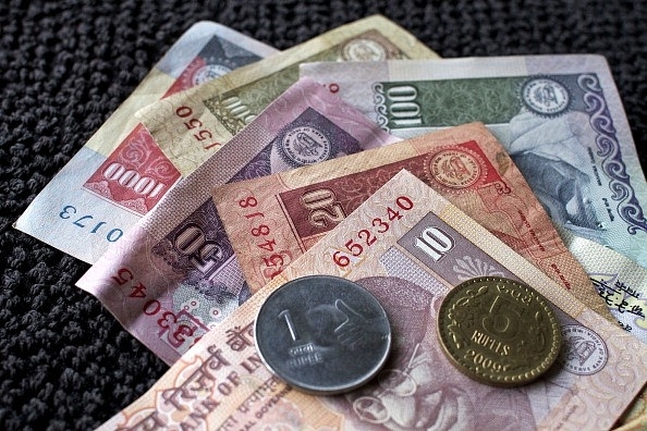 Indian rupee banknotes and coins (Photo by Adeel Halim/Bloomberg via Getty Images)