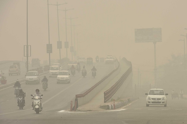 Slow moving traffic due to Smog in Delhi (Raj K Raj/Hindustan Times via GettyImages)