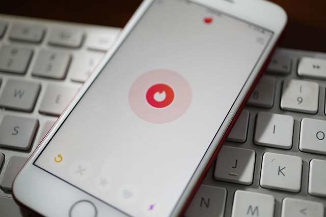 In this photo illustration, the dating app Tinder is seen on the screen of an iPhone on August 14, 2018 in Miami, Florida.(Photo illustration by Joe Raedle/Getty Images)