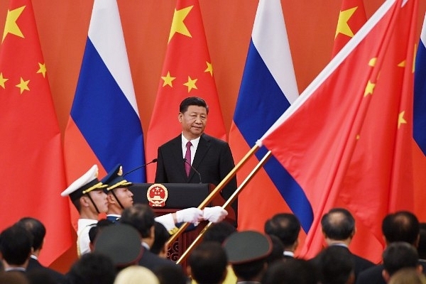 Russian President Vladimir Putin Receives Friendship Medal In Beijing (Photo by Nicolas Asfouri - Pool/Getty Images)