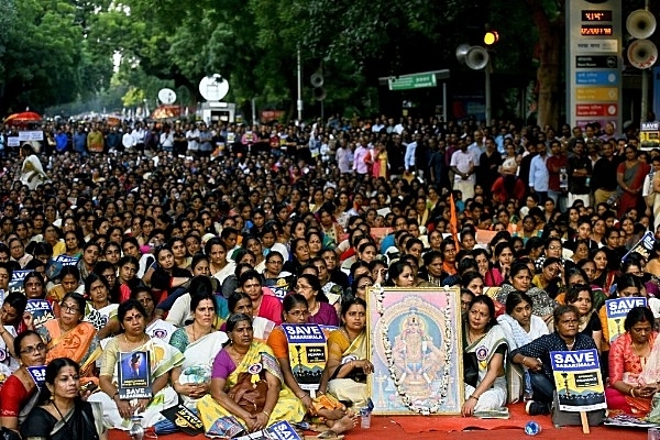 Devotees hold placards during a protest against the Supreme Court verdict on Sabarimala (Photo by Amal KS/Hindustan Times via Getty Images)