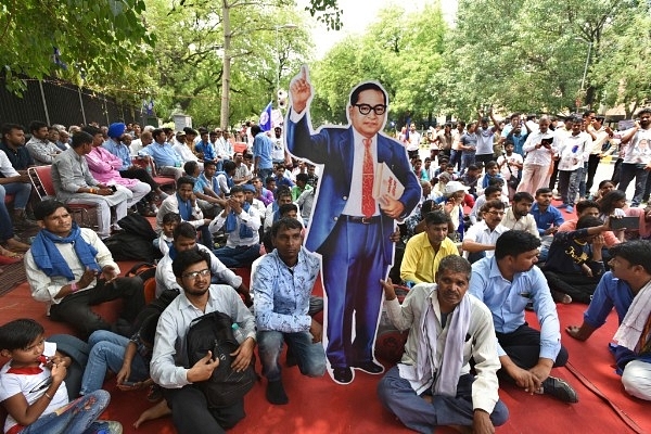 People from Dalit and tribal communities protest against atrocities, and demand for justice at Parliament Street in New Delhi. (Sushil Kumar/Hindustan Times via GettyImages)&nbsp;