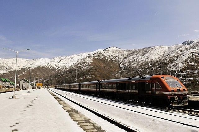  A train passes through snow covered railway track with the back drop of Snow Mountain after a heavy snowfall in Banihal some 110 km from Sringar. (Representative Image/Waseem Andrabi/Hindustan Times via Getty Images)&nbsp;