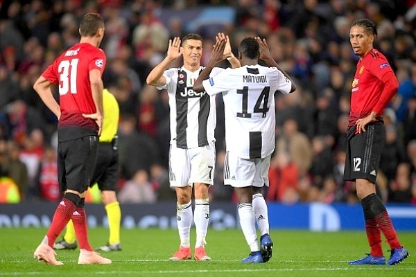 Cristiano Ronaldo celebrates along with Blaise Matuidi. (Laurence Griffiths/Getty Images)