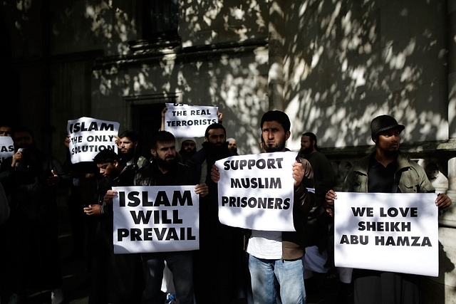 Protestors demonstrate against the intended extradition of five terror suspects to the USA on terrorism charges outside the Royal Courts of Justice on 5 October 2012 in London (Matthew Lloyd/GettyImages)