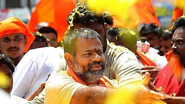 Swami Paripoornananda embracing supporters (Pic: Facebook)