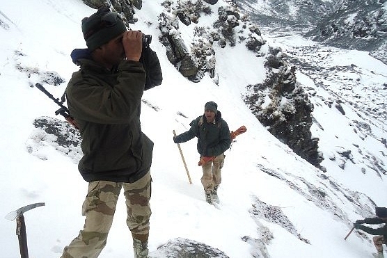 An ITBP Himveer Observing Terrain [Photo Credit : ITBP Website]