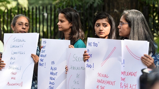 Women hold placards against sexual harassment in workspaces. (Mohd Zakir/Hindustan Times via Getty Images)