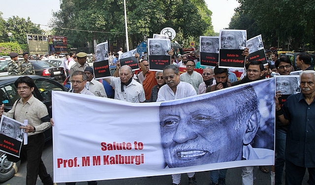 Writers, readers and activists participate in a silent protest against MM Kalburgi’s murder at Mandi House in New Delhi. (Photo by Sanjeev Verma/Hindustan Times via Getty Images)