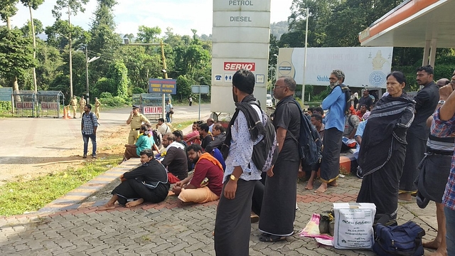 Devotees waiting at Nilakkal base camp for KSRTC buses, as police have blocked private vehicles from entering Pamba (Pic via Twitter)