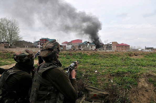 Security forces during an operation in Budgam in March. (Photo by Waseem Andrabi/Hindustan Times via Getty Images)