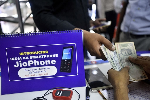 Customer at Reliance store for jio phone pre-booking at Connaught Place, on August 24, 2017 in New Delhi (Arun Sharma/Hindustan Times via Getty Images)