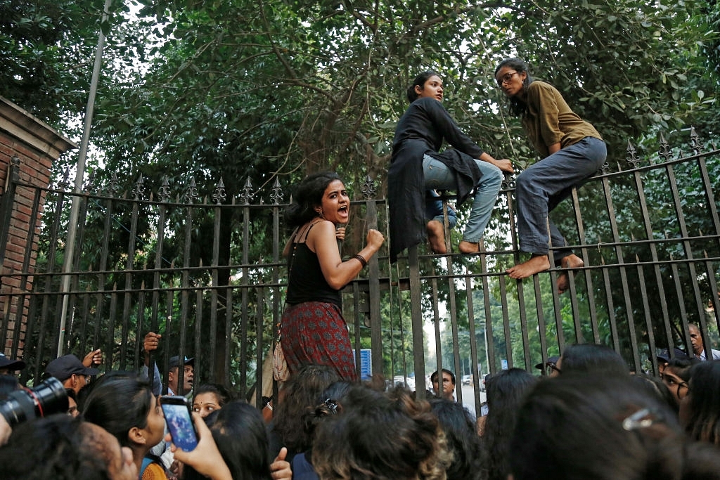 Girl students of Delhi University and members of Pinjratod protest for their demands regarding to equal rules for men and women in Indian universities. (Sanchit Khanna/Hindustan Times via Getty Images)