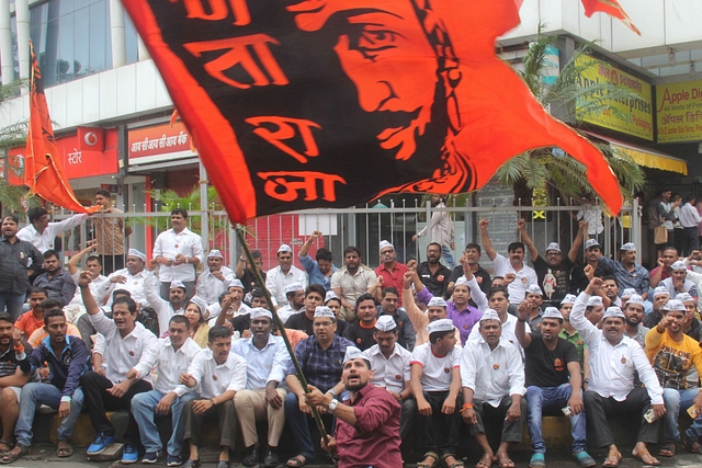 Maratha protestors carry a flag of Chhatrapati Shivaji in Lalbaug, Mumbai (Bhushan Koyande/Hindustan Times)