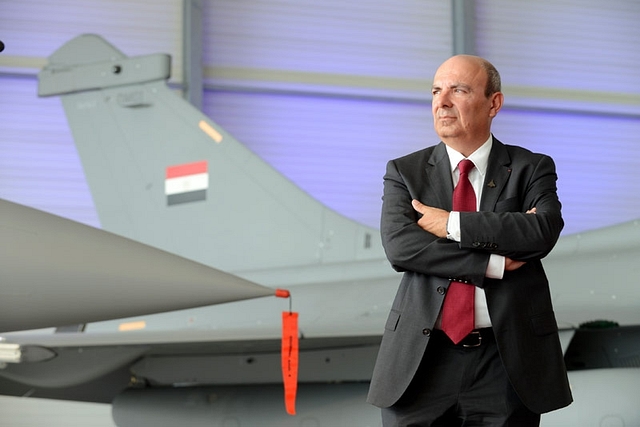 Dassault Aviation CEO Eric Trappier with a Rafale fighter jet in the background.&nbsp;