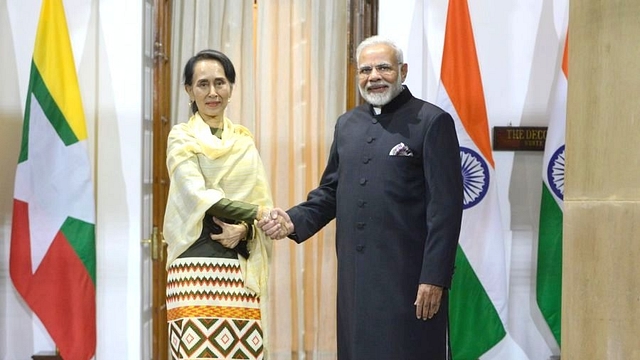 PM Narendra Modi shakes hands with Myanmar leader Aung San Suu Kyi before a meeting. (Pankaj Nangia/India Today Group/Getty Images)