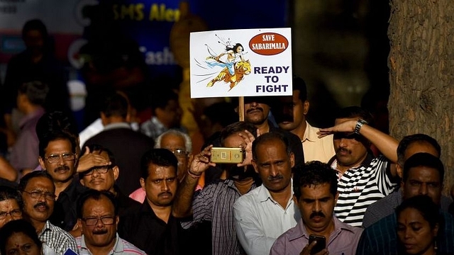 Ayyappa devotees stage protests against the SC verdict on Sabarimala. (Amal KS/Hindustan Times via Getty Images)