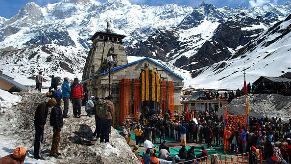 Char Dham pilgrims awaiting their turn to pray at the Kedarnath temple. (Vinay Santosh Kumar/Hindustan Times via Getty Images)