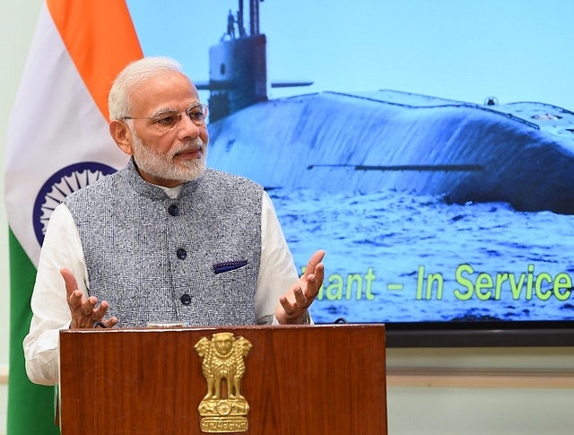 Prime Minister Narendra Modi speaking at an event with an image of INS Arihant, its clearest pictures, in the background. (@narendramodi/Twitter)