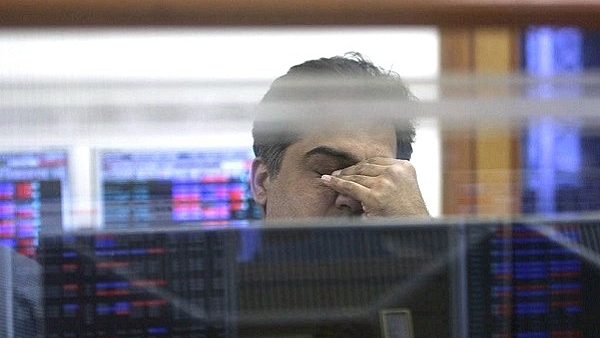 A trader at his desk viewing stock prices. (Indranil Bhoumik/Mint via Getty Images)