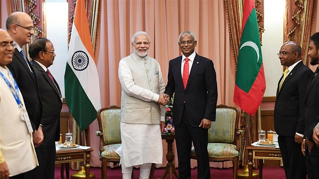 Prime Minister Modi meets President Solih during his visit to the latter’s swearing-in ceremony in Malé. (PMO India via Twitter)