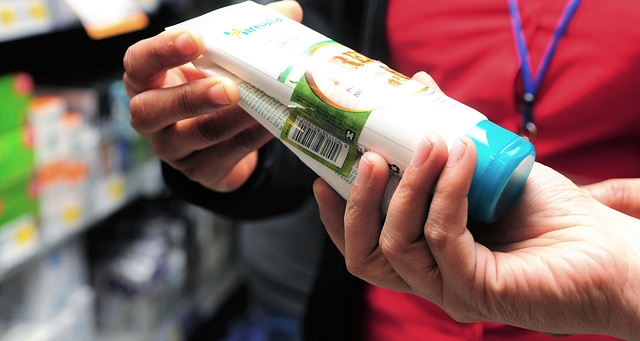 A customers checking the price of a product (Photo by Ramesh Pathania/Mint via Getty Images)