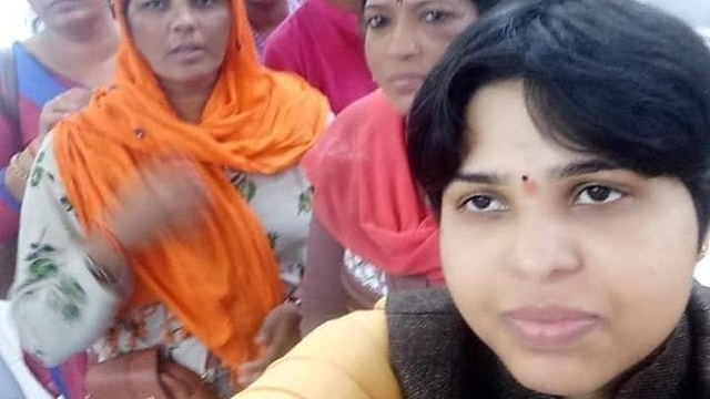 Trupti Desai (R) with her troupe at the Cochin airport.&nbsp;