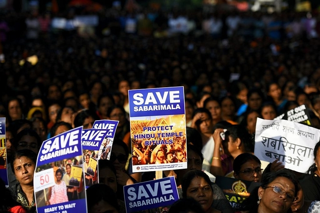 Devotees protest against the Supreme Court verdict on the Sabarimala shrine in New Delhi  (Photo by Amal KS/Hindustan Times via Getty Images)