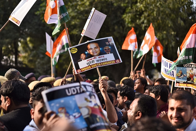 Indian Youth Congress activists and workers scuffle with police during a protest march against Finance Minister Arun Jaitley and Punjab National Bank (PNB) scam (Burhaan Kinu/Hindustan Times via GettyImages)