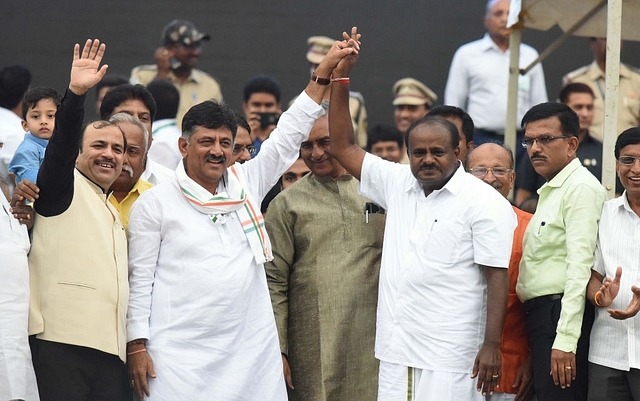 Congress leader DK Shivakumar with the new Chief Minister of Karnataka Kumarswamy  (Photo by Arijit Sen/Hindustan Times via Getty Images)