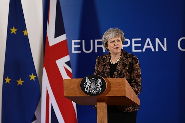 British Prime Minister Theresa May asserts the policy ensures “workers’ skills that matter, not which country they come from”. (Photo by Dan Kitwood/Getty Images)