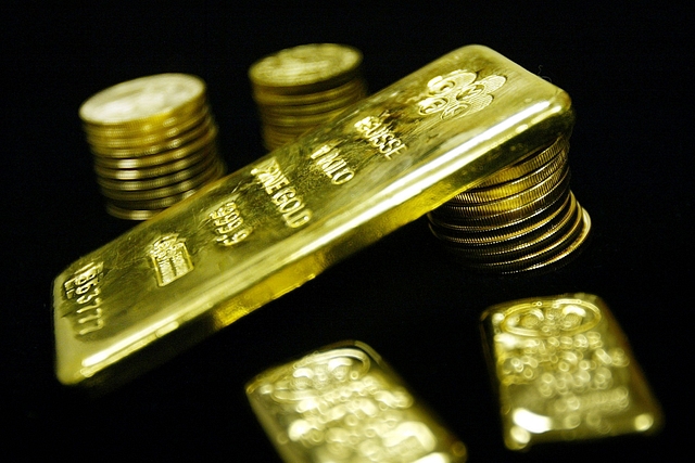 Old bullion bars and coins are seen for sale at Manfra, Tordella and Brookes, Inc. January 9, 2003 in New York City (Photo by Mario Tama/Getty Images)