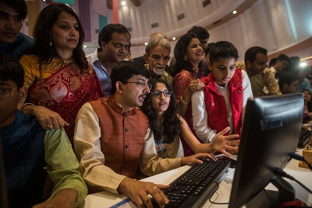 A stock broker and his family watch the Diwali Muhurat trading at Bombay Stock Exchange (BSE)  (Photo by Pratik Chorge/Hindustan Times via Getty Images)